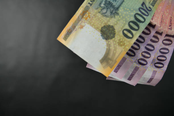 istock Hungarian forint banknotes held in hand. 1461364688
