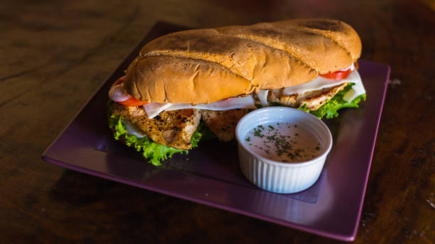 istock Boost your visual impact with our sauced chicken sandwich on a rustic wooden table 1461366643
