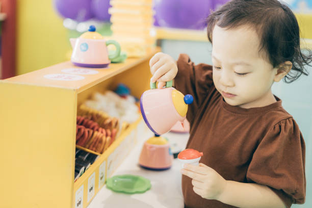 istock Baby girl playing toy 1461366676