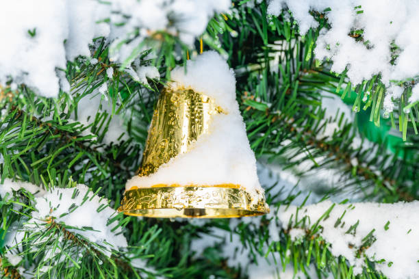 istock Christmas decorations hanging on a pine tree with glitter, 1461367960