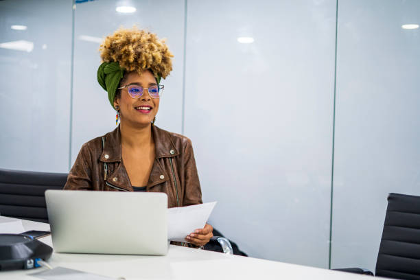 istock Latin woman is working at office with her laptop 1461367983