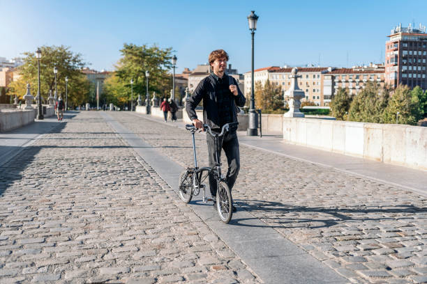 istock Young Man Using Bike Portrait 1461369756