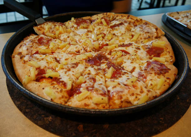 istock Fresh baked Pizza in an iron pan 1461371723