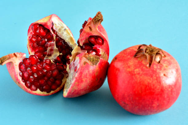 istock fresh garden pomegranate with seeds isolated, close-up 1461373210