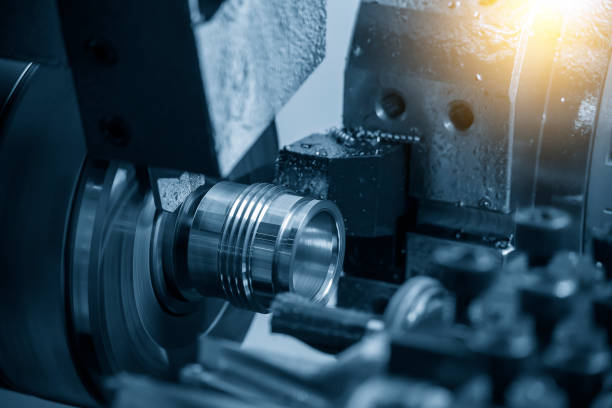 istock The multi-tasking CNC lathe machine swiss type thread cutting the metal pipe parts. 1461374629