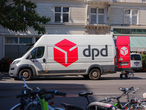 Vienna, Austria - August 11, 2022: Parked DPD Courier Delivery Van over downtown. DPDgroup is an international parcel delivery service with an extensive network