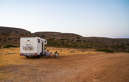 Asian Chinese Lesbian couple enjoying campervan outdoor road trip during weekend morning