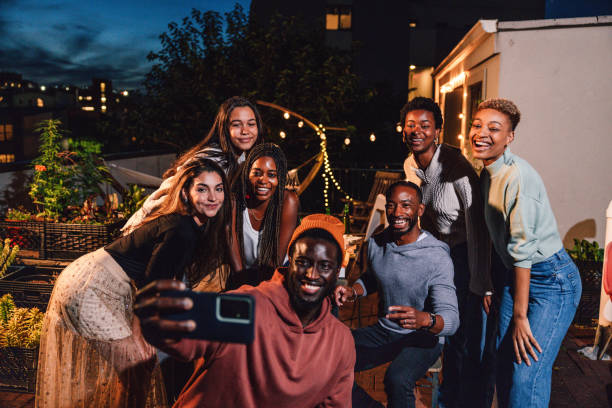 istock Friends having fun at a party and take a selfie at the dining table 1461380609