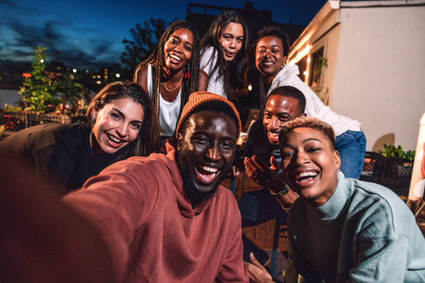 istock Selfie with friends at party 1461383537