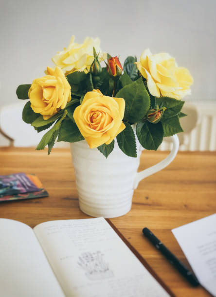 istock Yellow roses in a jug vase 1461383598