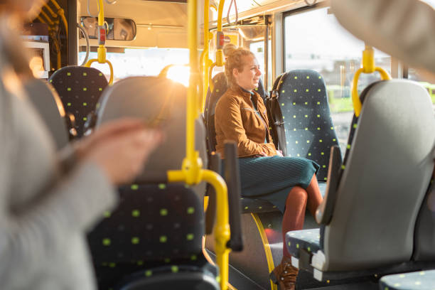 istock Woman sitting in bus and looking through window 1461384527