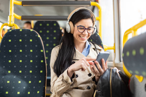 istock Woman using mobile phone at the public transport 1461385452