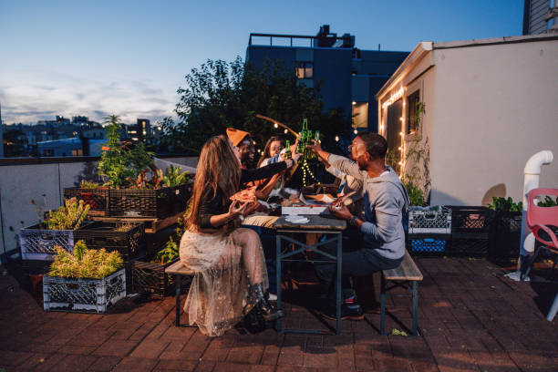 istock Friends dining on a rooftop and having a toast 1461385769