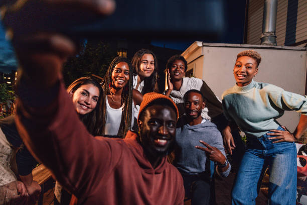 istock Friends having fun at a party and take a selfie at the dining table 1461386057