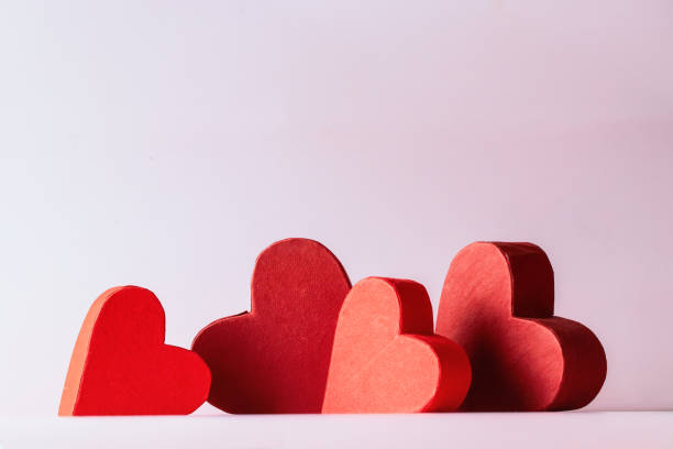 istock Many red hearts on pink gradient background for festive image with copy space 1461387644