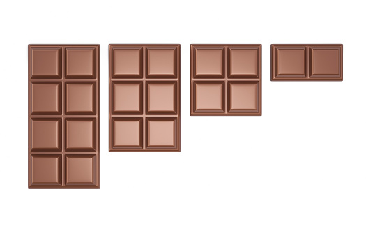 Black chocolate bar and candies isolated on a white background.