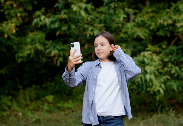 istock Closeup image of a beautiful girl waving hands while using mobile phone for video call 1461398630