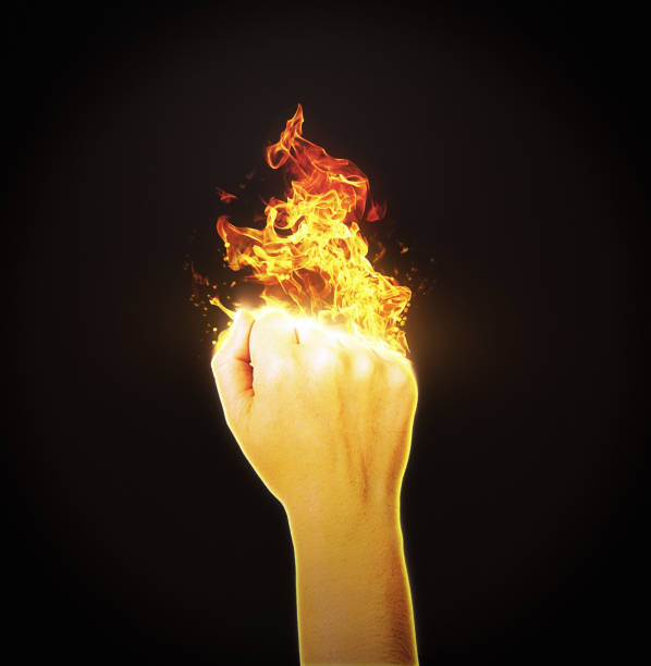 istock Woman power: clenched female fist erupting into flames 1461400201