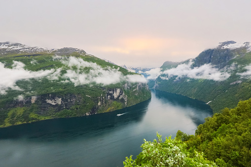 Norwegian Geiranger fjord (UNESCO World Heritage Site),  with majestic nature, wild waterfalls and green water and vegetation