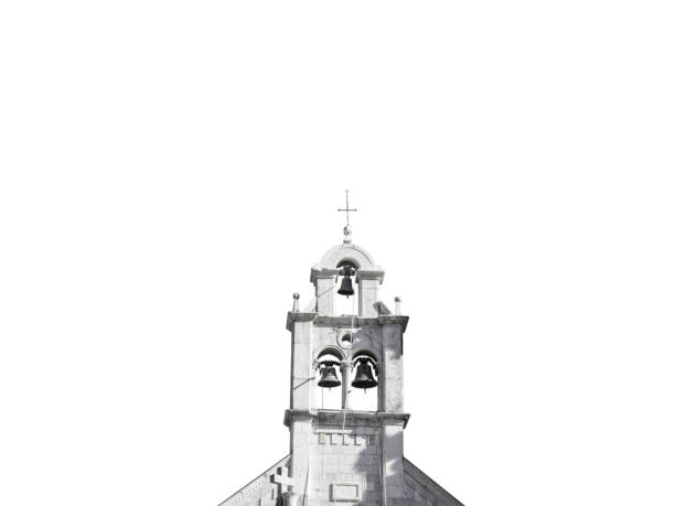 Christian church white stone bell tower on clear blue sky front view isolated on white
