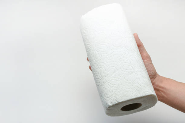 Using paper towel, hand holding paper towel