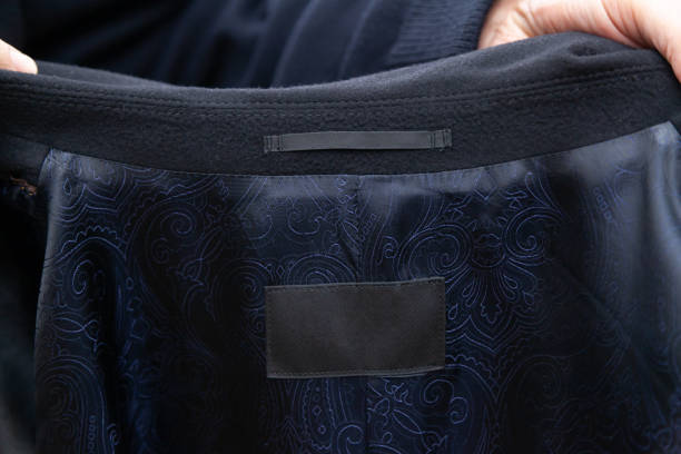 Gray patch on patterned lining inside coat stock photo