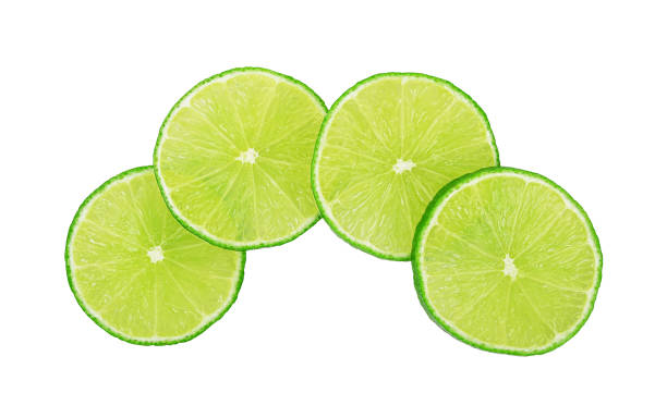 istock Slices of fresh lime fruit isolated on white 1461401602