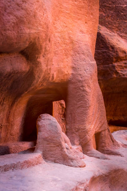 istock Petra, Jordan man and camel sculptures carved wall 1461401973