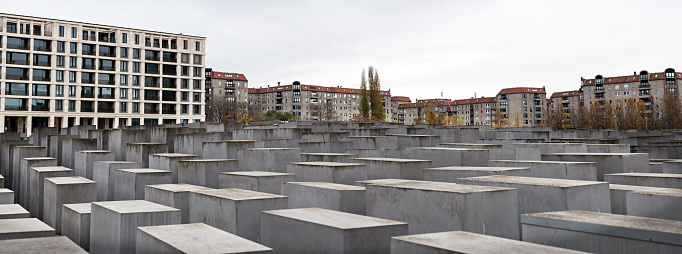 On November 19th 2022, the Memorial to the Murdered Jews in Europe in Berlin in panoramic view. Its has 2,711 concrete slabs organized in a a grid of 54x87 rows and colums in 200,000 sq ft. There is a museum in the basement.