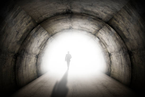 istock Businessman Walking Out Of A Tunnel 1461403342