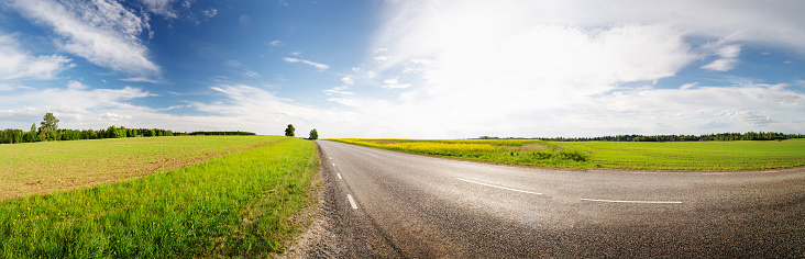 Panoramic view of the empty road in countryside. Natural park in springtime.