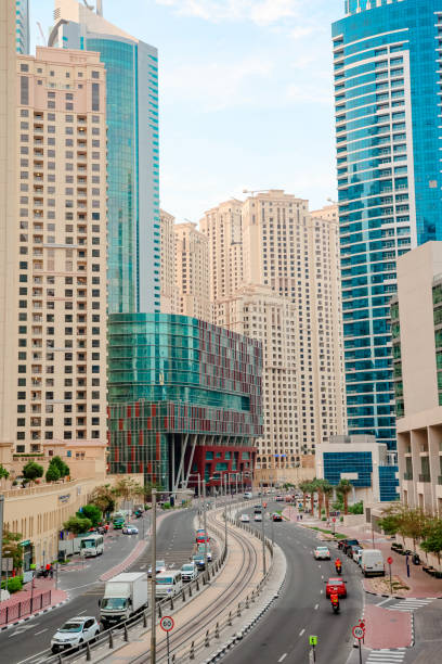 istock Dubai Marina street with skyscrapers, road, car and Emaar building, 1461408708