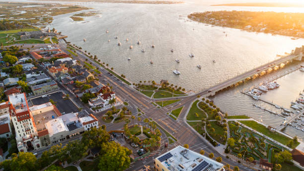 aerial view of the downtown saint augustine with the bridge of lions over the matanzas river and the cathedral basilica of st. augustine, florida. - saint augustine cathedral imagens e fotografias de stock