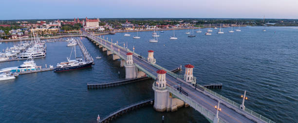 Saint Augustine, Florida. The Bridge of Lions over the Matanzas River, with the distant view of the skyline, on the morning. Extra-large, high-resolution stitched panorama. The Bridge of Lions over the Matanza River and the distant view of  the skyline of Saint Augustine, Florida, on the morning. Extra-large, high-resolution  stitched panorama. bridge of lions stock pictures, royalty-free photos & images