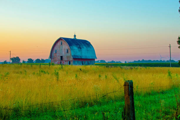 istock Old weathered Red Barn at sunrise-Howard County, Indiana 1461415642