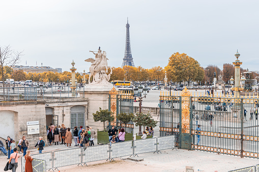 Entrance of the Tuileries Garden, Place de la Concorde square and Eiffel Tower in Paris, France