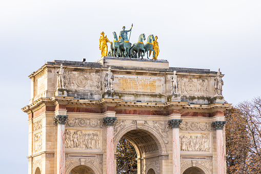 Top of the Arc de Triomphe du Carrousel with the replica of the Quadriga of Saint Mark horses in Paris, France