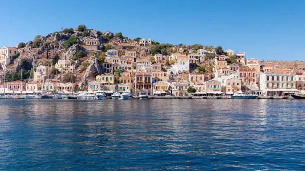 Colored houses on the embankment of Symi island.