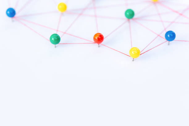 istock Linking entities, Blockchain, social media, Communications Network, The connection between the two networks. Network simulation on paper linked together by yarn 1461421171