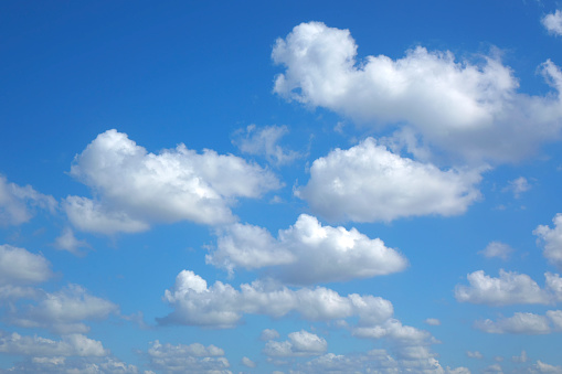 Background image of sunny blue sky with white clouds