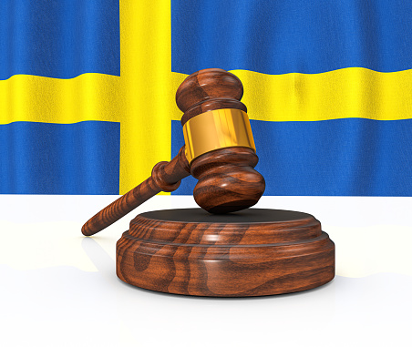Sweden Law Concept - Swedish Flag and Judge's Gavel