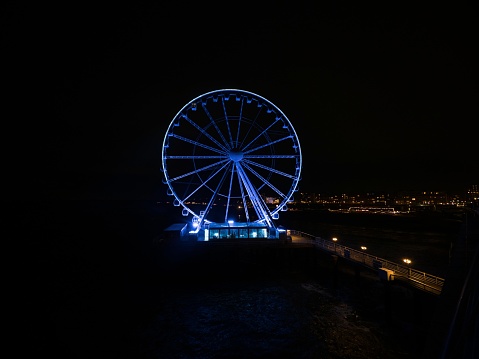 The empty Seattle Ferris wheel illuminated with a heart for healthcare workers during the covid-19 pandemic and stay at home order.