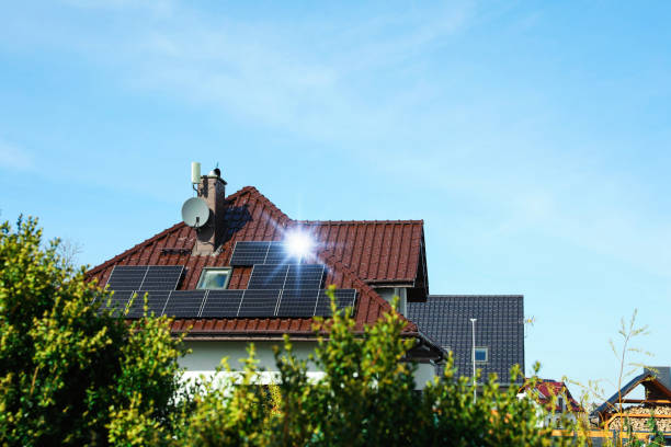 istock House with installed solar panels on roof, space for text. Alternative energy 1461426643