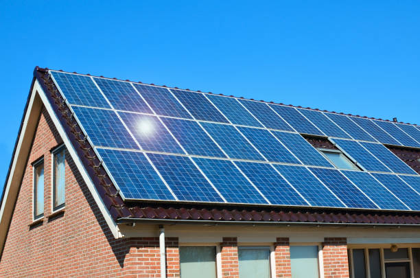 istock Building with installed solar panels on roof. Alternative energy source 1461426692