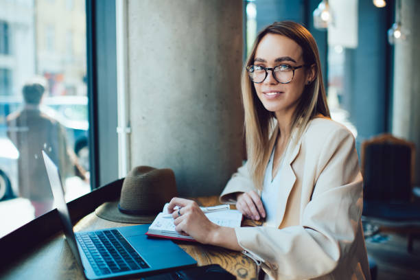 istock Female entrepreneur working in cafe 1461433548