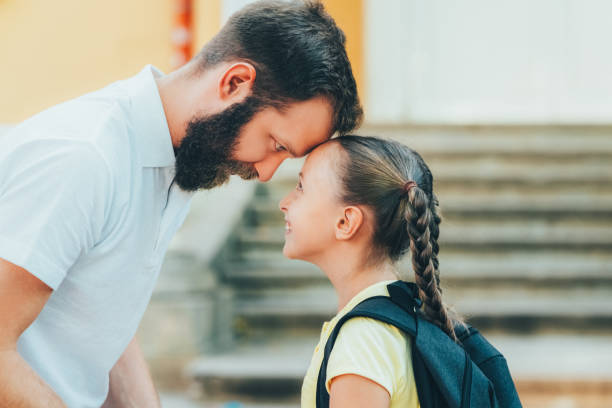 istock Father leaving daughter on her first day at school 1461435522