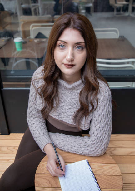 istock Young beautiful woman working with notebook in cafe 1461437022
