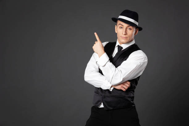 istock Confident young man posing in gangster style suite. 1461437058