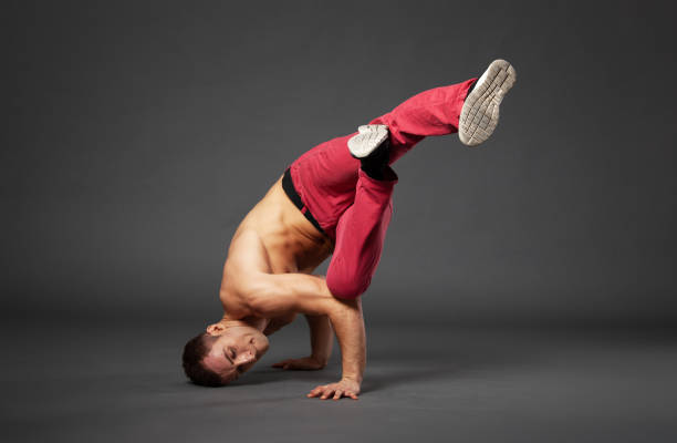 istock Young male professional dancer B-boying in studio isolated on gray. 1461437346