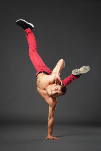 istock Young male professional dancer B-boying in studio isolated on gray. 1461437455